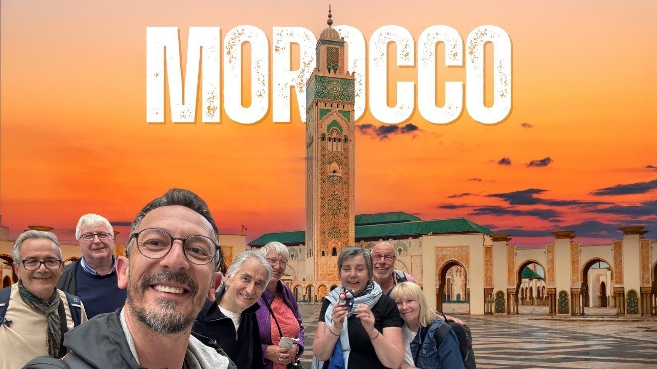 Happy group of international travellers posing in front of Hassan
II Mosque Casablanca at sunset --- Morocco Live Trips 7-day Grand Tour
from Casablanca