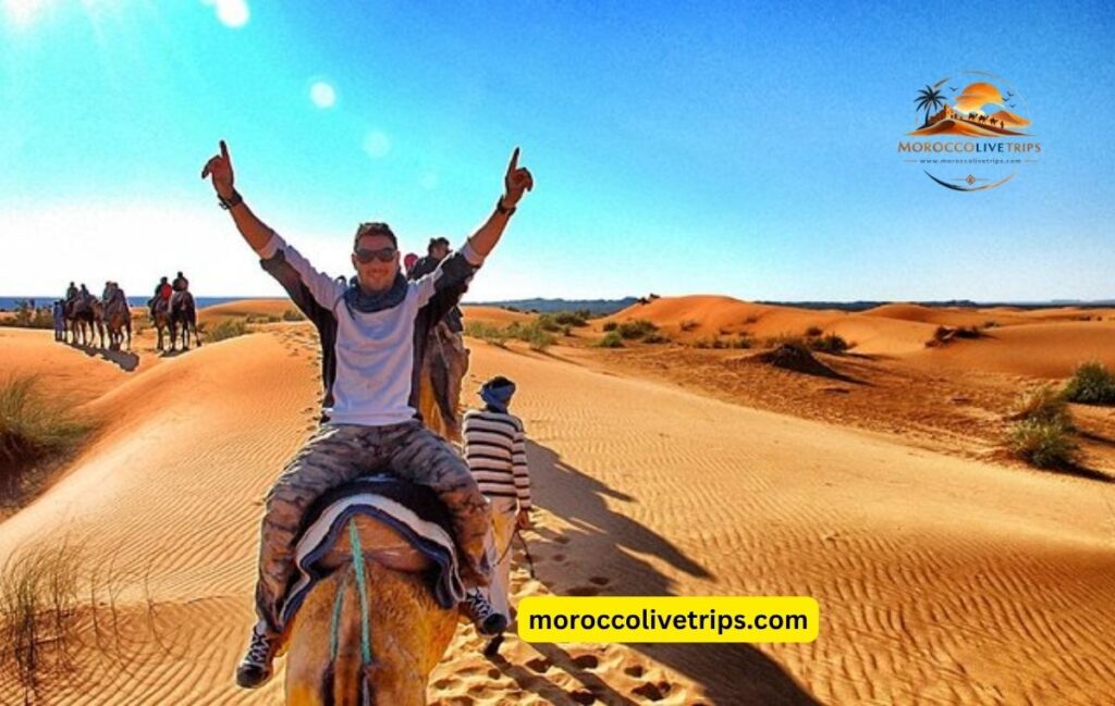American tourists enjoying Morocco desert tour with local guide at Sahara dunes sunset