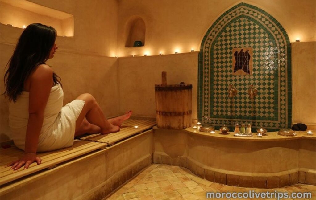Tourist relaxing in a Moroccan steam bath before kessa exfoliation in Marrakech